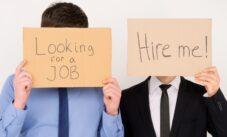 Unemployed Office Workers Holding Cardboard Signs Job Hunting