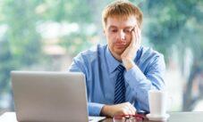 Tired Young Businessman With Laptop